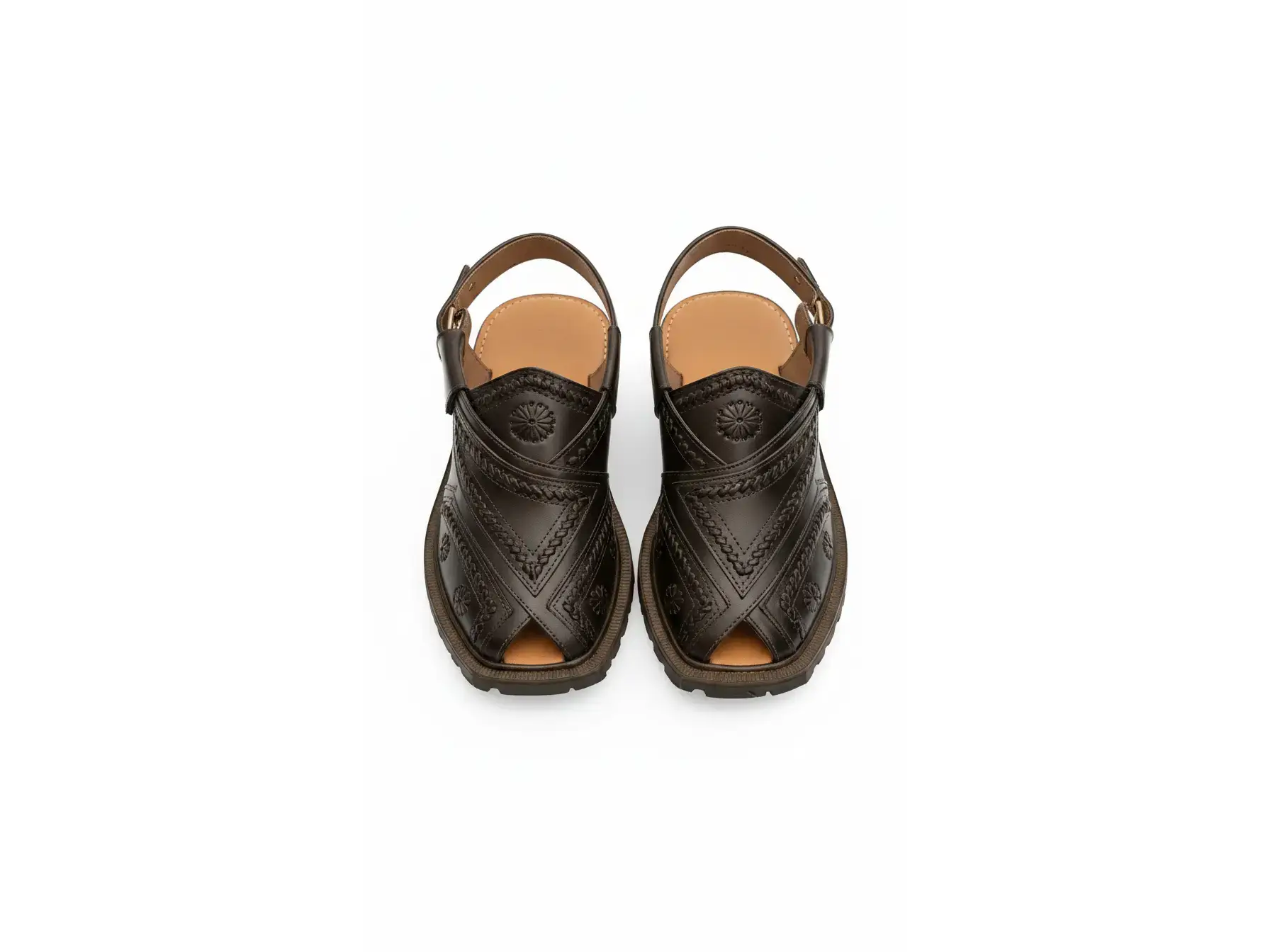 Nomad Rugged Tooled Leather Sandals in dark brown with floral stamps and a heavy lug sole on a white background.